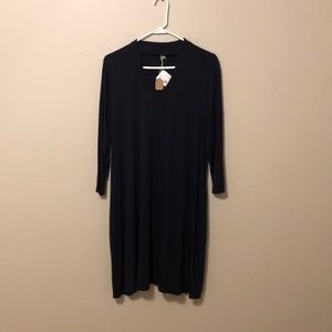 Brand new navy blue dress with unique neckline.